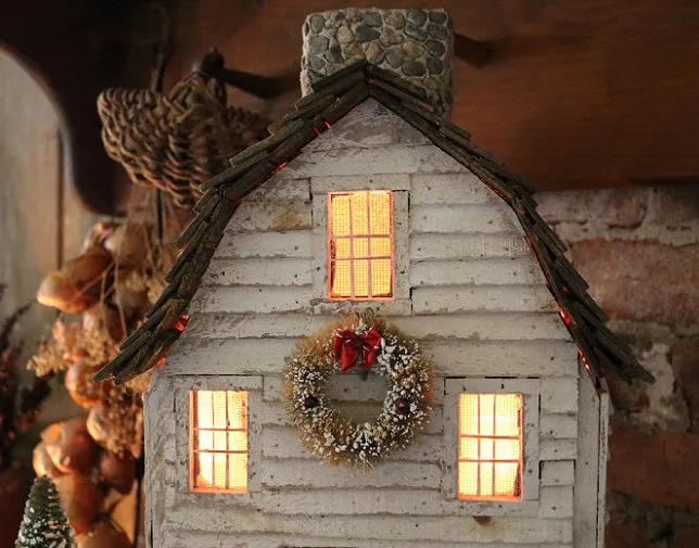 Meeting House showing Clapboard Siding with Candles Lights Up