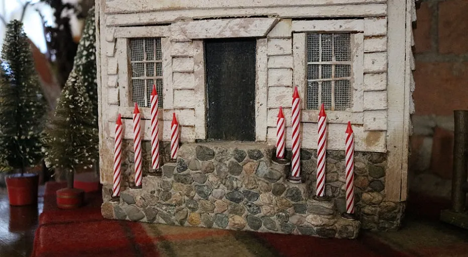 Meeting House showing Clapboard Siding with Candles Lights Up