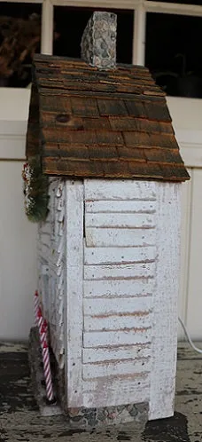 Meeting House showing Clapboard Siding with Candles Lights Up